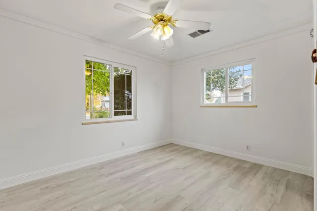 a bathroom with a sink a mirror toilet and bathtub