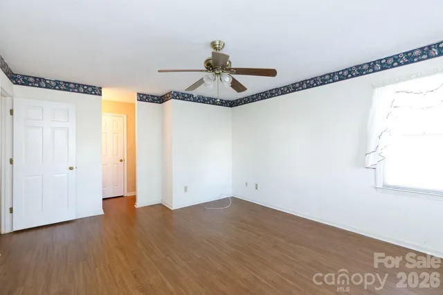 a very nice looking room with wooden floor