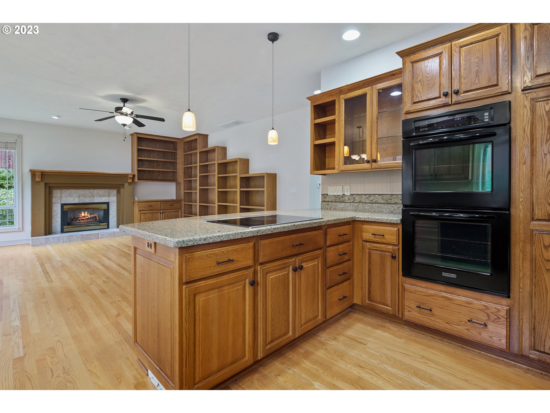 1236 Southeast 26th Drive Gresham, OR 97080 - Photo 12 of 48 a kitchen with stainless steel appliances granite countertop a stove top oven a sink and dishwasher