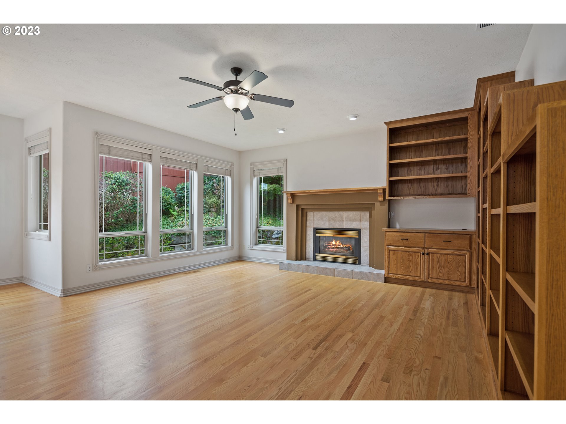 1236 Southeast 26th Drive Gresham, OR 97080 - Photo 18 of 48 a view of an empty room with a window and wooden floor