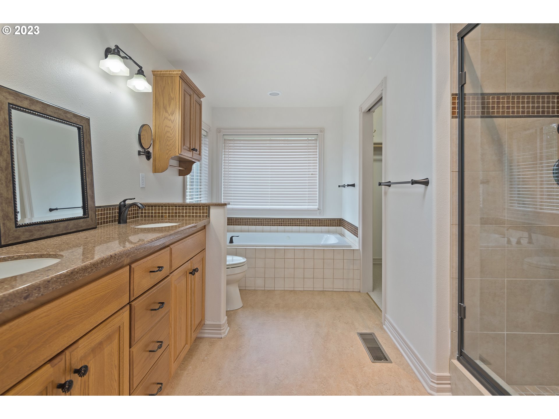 1236 Southeast 26th Drive Gresham, OR 97080 - Photo 26 of 48 a bathroom with a granite countertop sink mirror and a bathtub