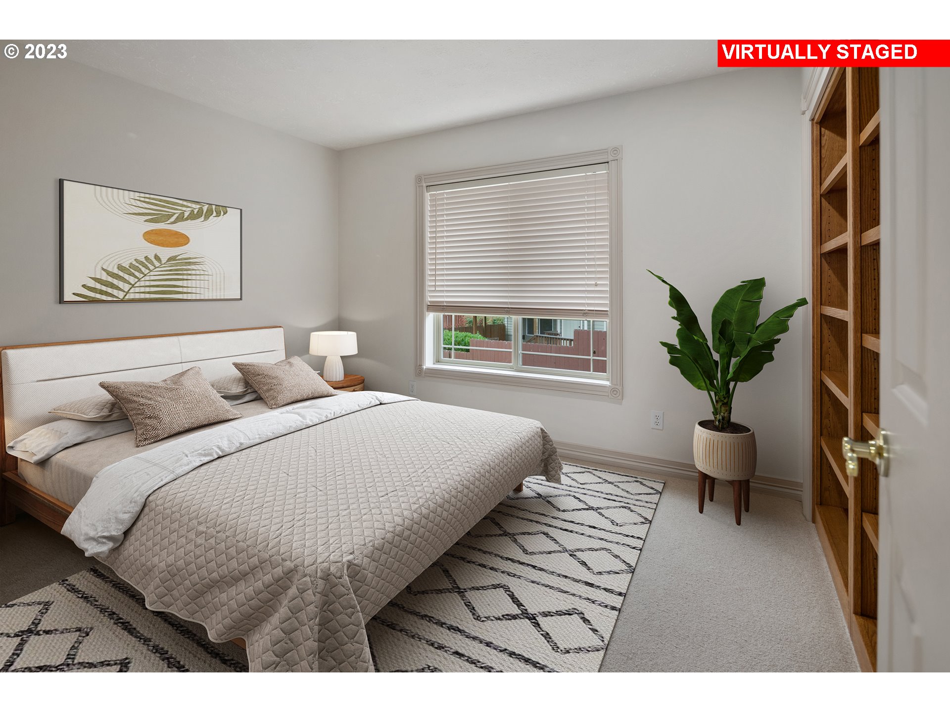 1236 Southeast 26th Drive Gresham, OR 97080 - Photo 33 of 48 a bedroom with a large bed and a potted plant