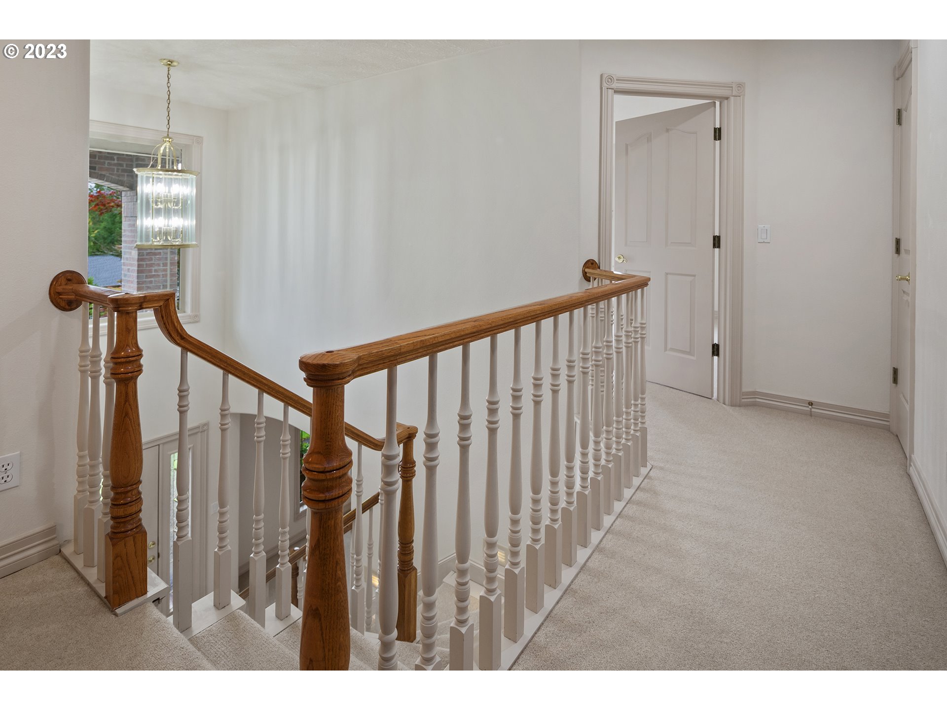 1236 Southeast 26th Drive Gresham, OR 97080 - Photo 35 of 48 a view of a hallway with wooden floor and stairs