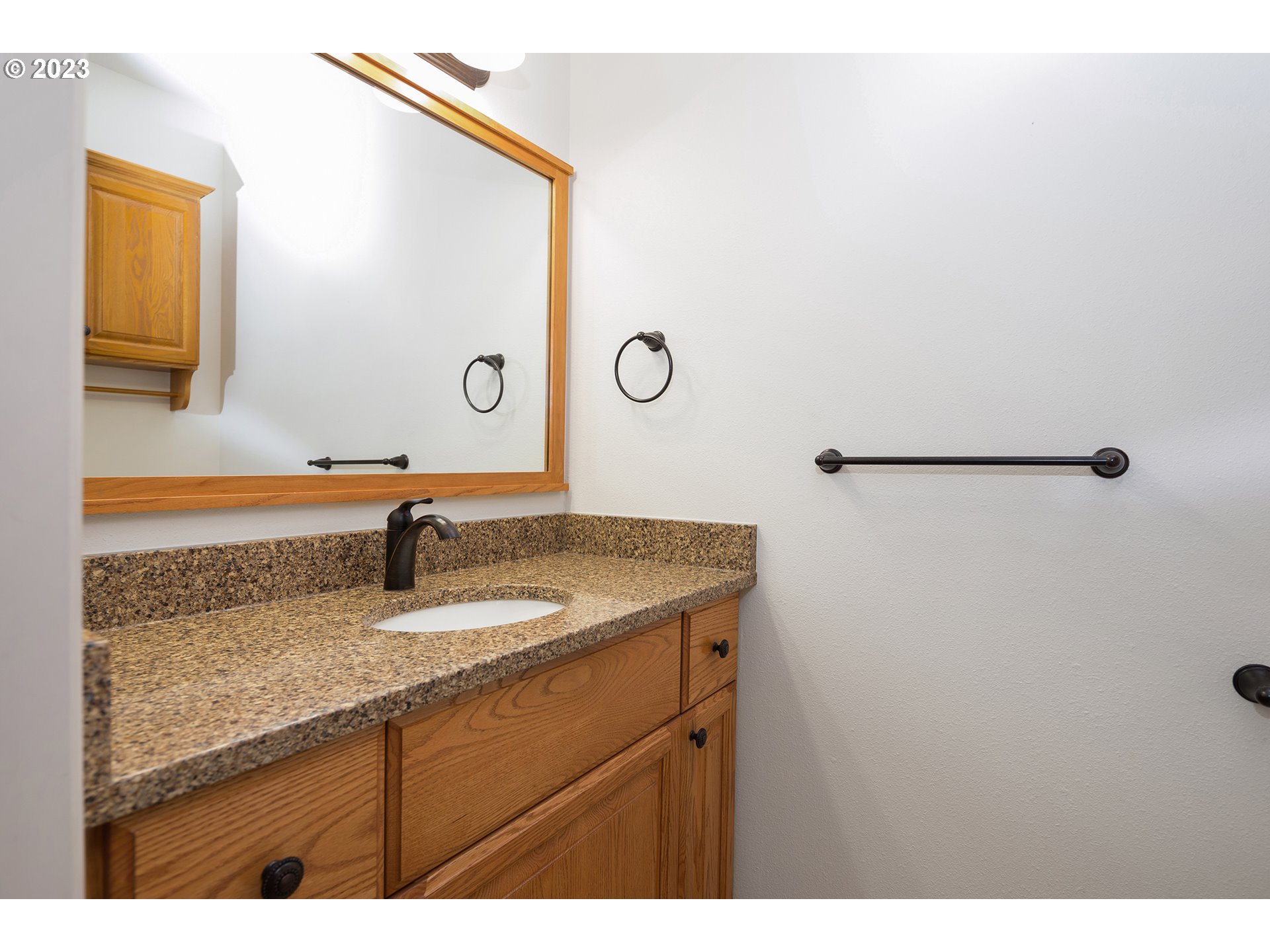 1236 Southeast 26th Drive Gresham, OR 97080 - Photo 38 of 48 a bathroom with a granite countertop sink and a mirror