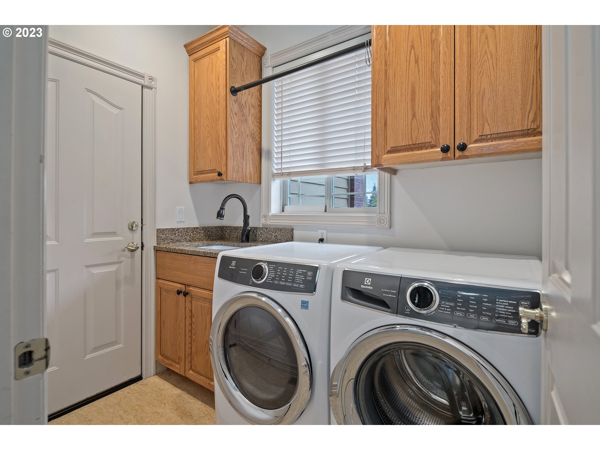 1236 Southeast 26th Drive Gresham, OR 97080 - Photo 39 of 48 a view of storage and utility room with washer and dryer