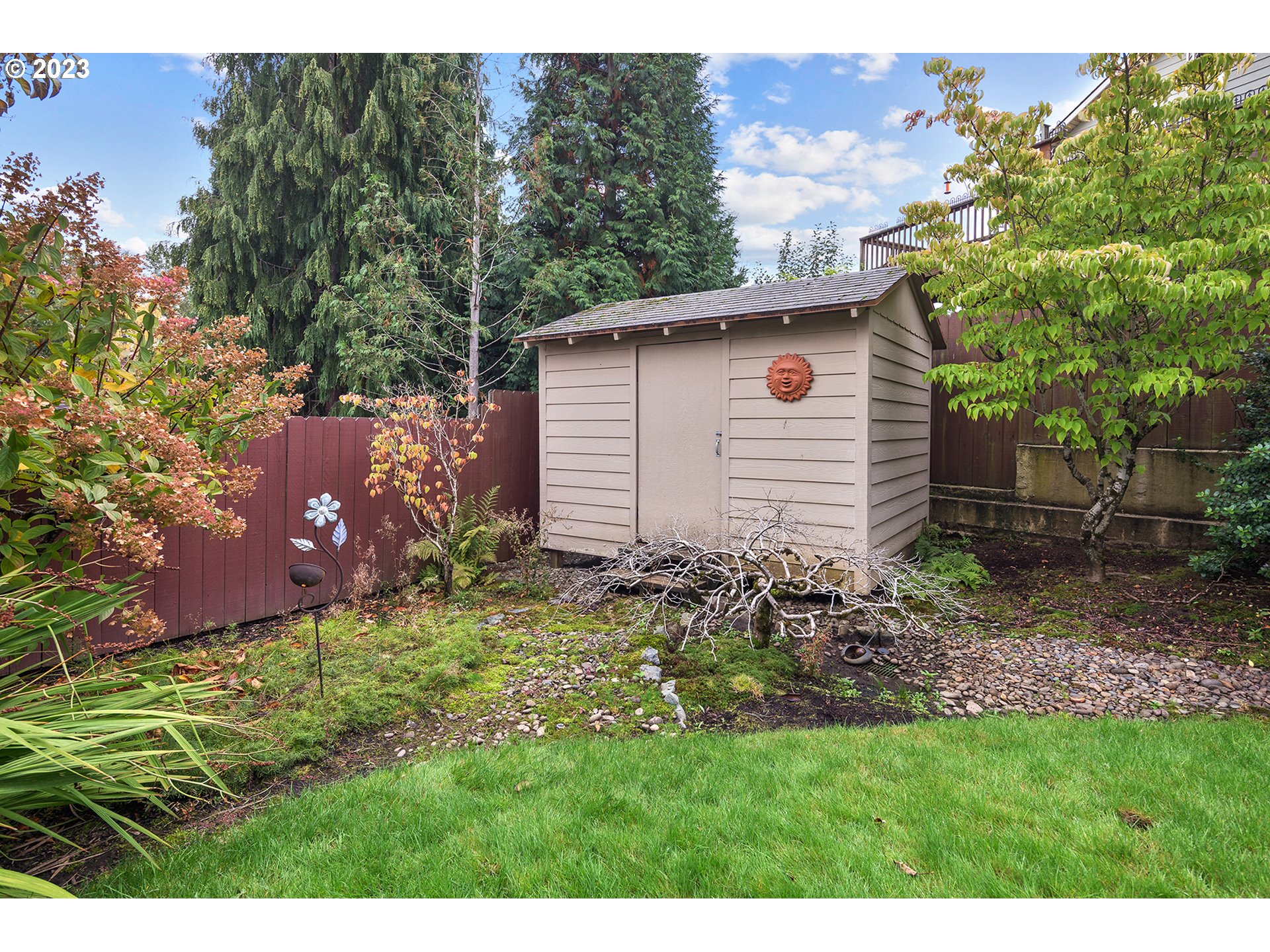 1236 Southeast 26th Drive Gresham, OR 97080 - Photo 45 of 48 a view of a backyard with plants and large trees