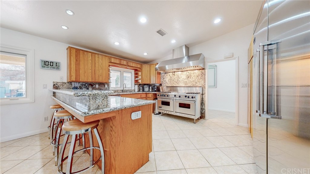 26127 Millstream Drive Canyon Country, CA 91387 - Photo 6 of 68 Custom Granite Breakfast Bar