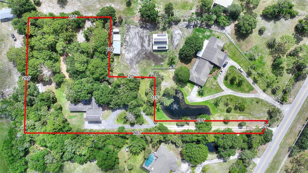3641 Turtle Mound Road Melbourne, FL 32934 - Photo 56 of 77 an aerial view of residential house with outdoor space and trees all around