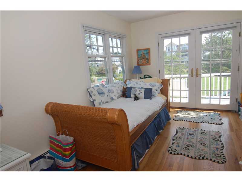 3 Yarmouth Road Rowayton, CT 06853 - Photo 12 of 15 a bedroom with a bed and a large window