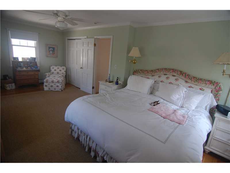 3 Yarmouth Road Rowayton, CT 06853 - Photo 13 of 15 a bedroom with a bed and a painting