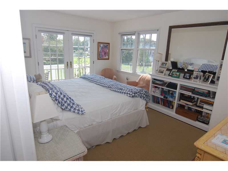 3 Yarmouth Road Rowayton, CT 06853 - Photo 14 of 15 a bed sitting in a bedroom next to a window
