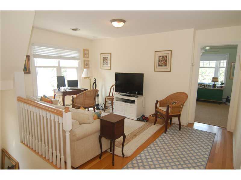 3 Yarmouth Road Rowayton, CT 06853 - Photo 15 of 15 a living room with furniture a flat screen tv and a window