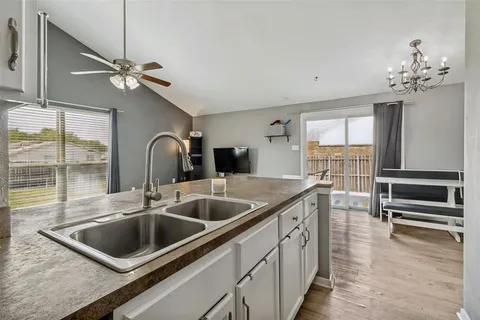 a kitchen with a sink and a refrigerator