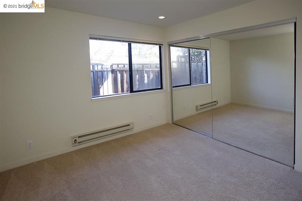 27 Windward Hill Oakland, CA 94618 - Photo 14 of 16 an empty room with windows