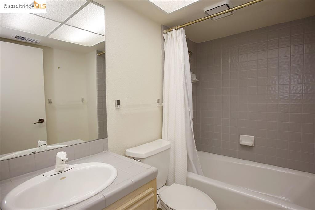 27 Windward Hill Oakland, CA 94618 - Photo 15 of 16 a bathroom with a sink toilet and shower