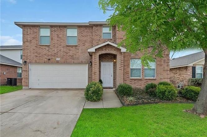 16516 Jasmine Springs Drive Fort Worth, TX 76247 - Photo 1 of 16 a front view of a house with a yard and garage