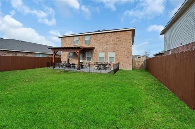 16516 Jasmine Springs Drive Fort Worth, TX 76247 - Photo 3 of 16 a view of a house with a yard and sitting area