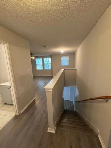 a view of an entryway with wooden floor