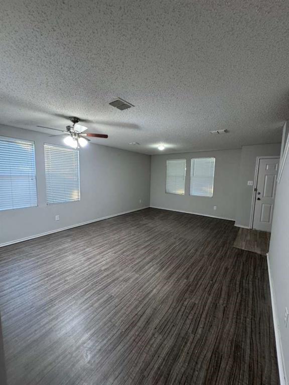 16516 Jasmine Springs Drive Fort Worth, TX 76247 - Photo 10 of 16 wooden floor in an empty room with a window