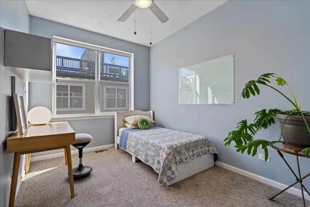 a bedroom with a bed and a couch