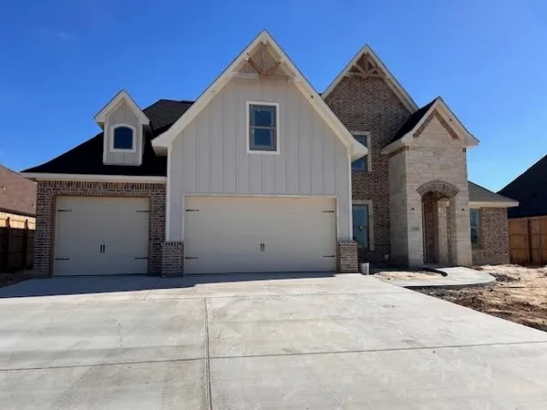 a front view of a house with garage