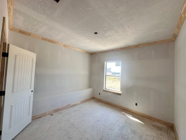 an empty room with windows and entrance