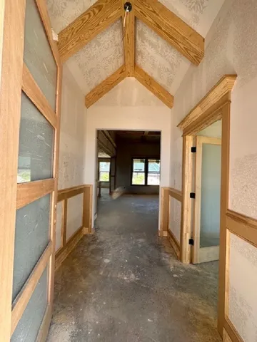 a view of empty room with window and fireplace