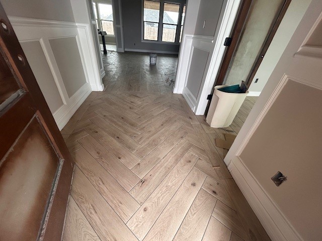 1310 Natashas Way Lumberton, TX 77657 - Photo 4 of 23 a view of a hallway with wooden floor and staircase