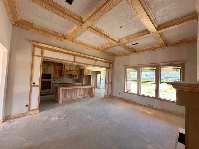 a view of an empty room and a window