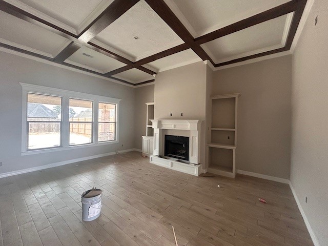 1310 Natashas Way Lumberton, TX 77657 - Photo 5 of 23 a view of empty room with a fireplace and wooden floor