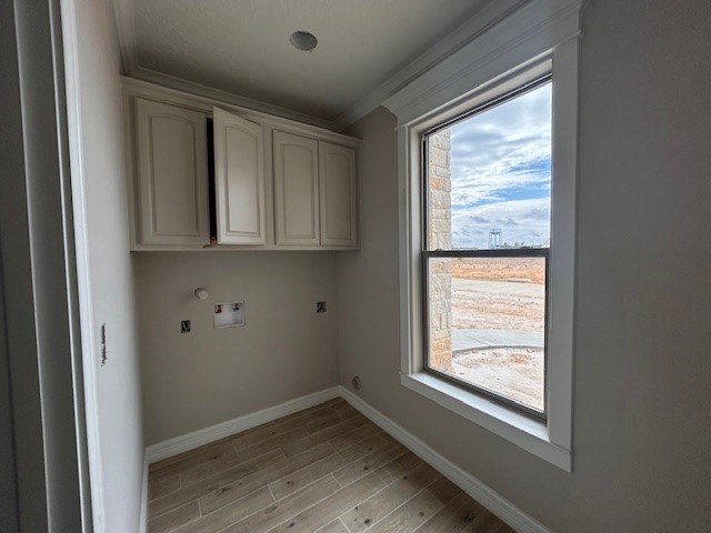 1310 Natashas Way Lumberton, TX 77657 - Photo 9 of 23 a view of an empty room with wooden floor and a window