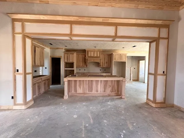 a kitchen with stainless steel appliances granite countertop a stove and a sink