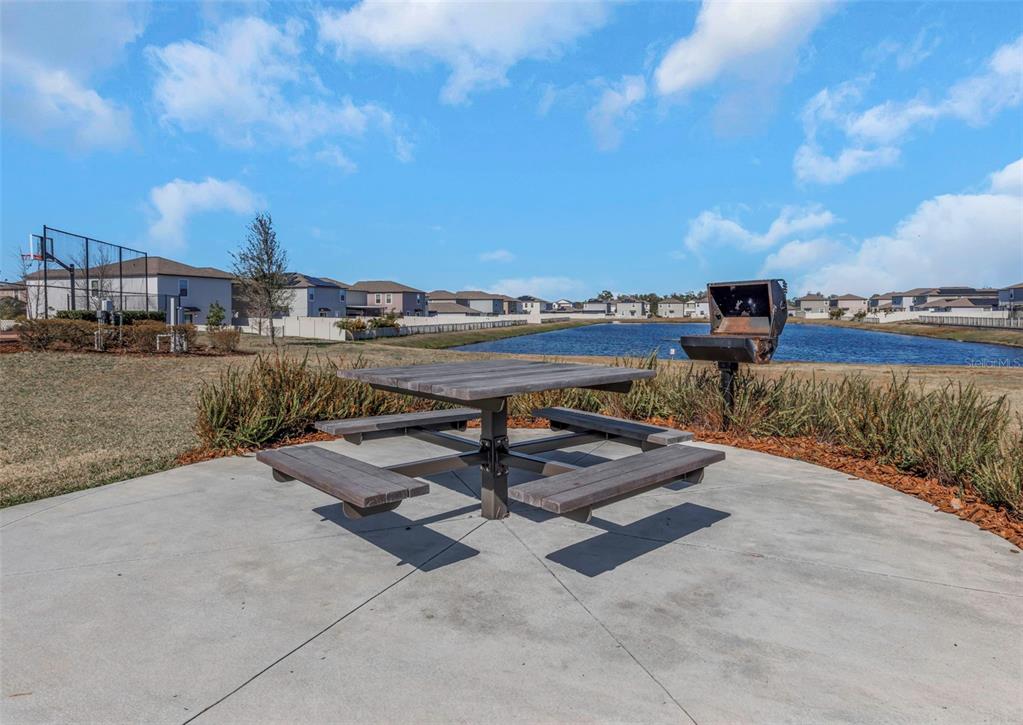 16612 Carlton Pond Street Wimauma, FL 33598 - Photo 59 of 65 a view of a terrace with sitting area