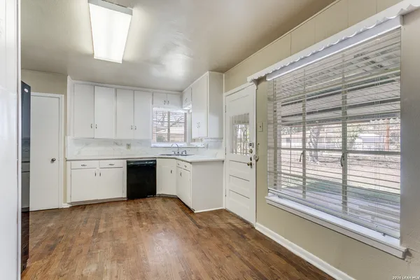 a kitchen with a stove a sink and a refrigerator