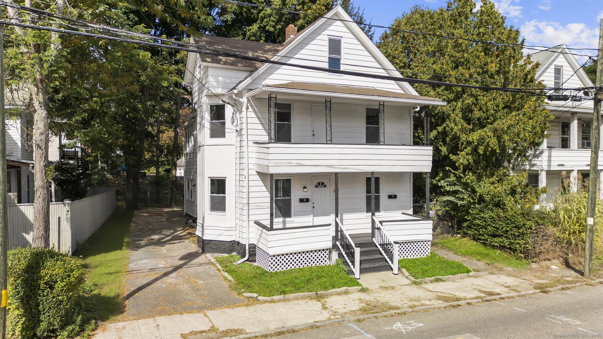 107 East Pearl Street Torrington, CT 06790 - Photo 1 of 1 a front view of a house with a yard