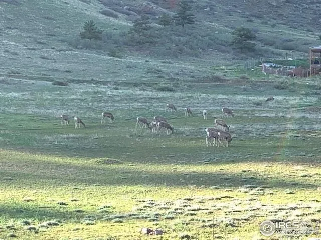 a view of mountain with an ocean