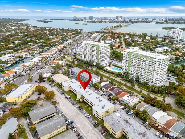 an aerial view of residential building and parking space