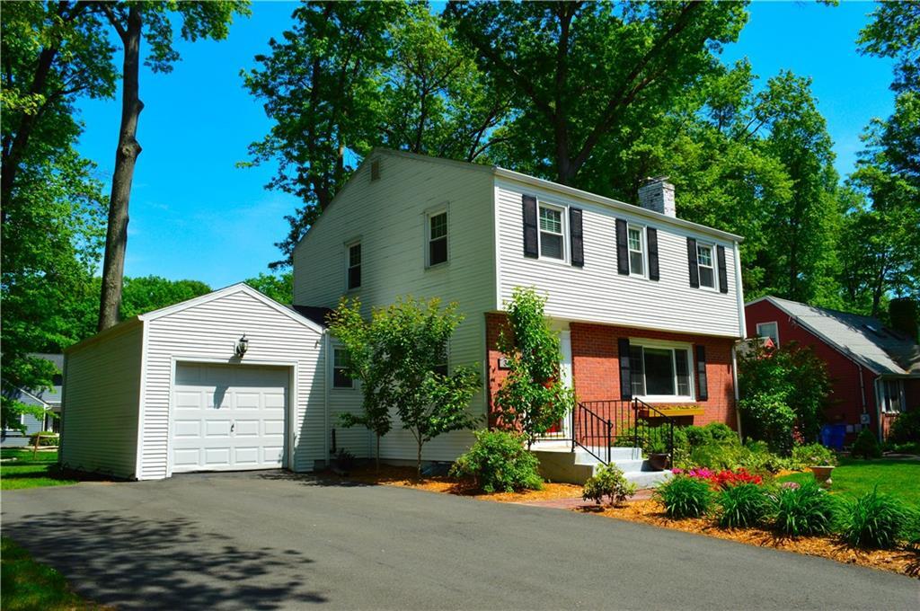 34 Seneca Road West Hartford, CT 06117 - Photo 1 of 1 a front view of a house with a garden
