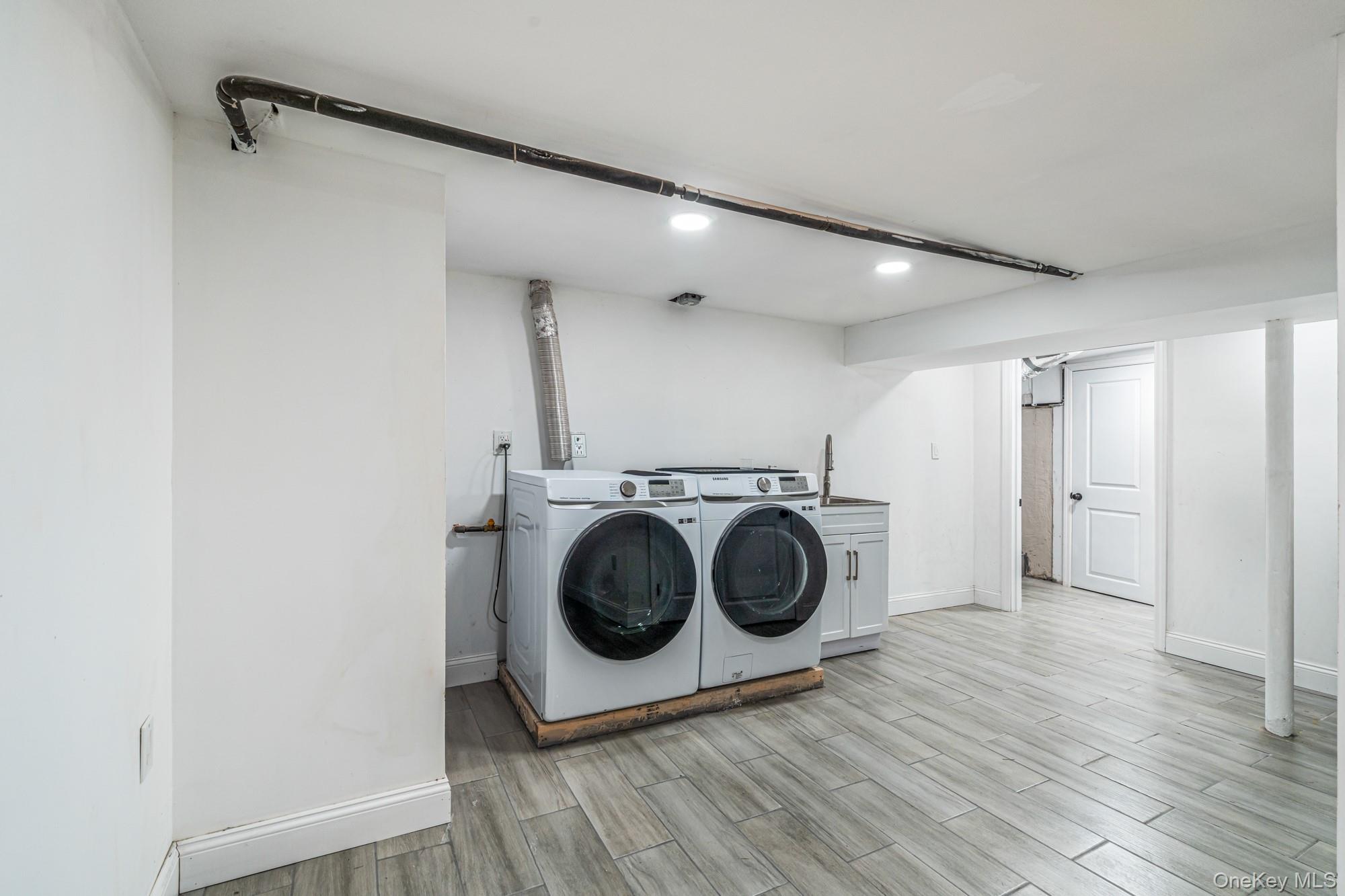 65 39th Street Islip, NY 11751 - Photo 18 of 30 a view of a storage & utility room with wooden floor