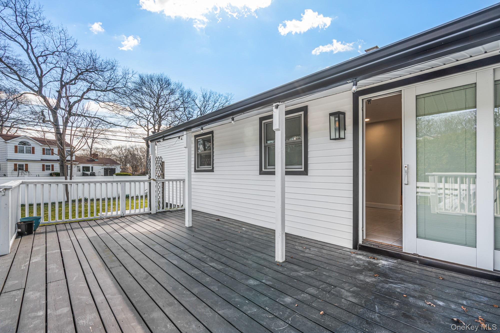 65 39th Street Islip, NY 11751 - Photo 30 of 30 a view of a house with a wooden deck