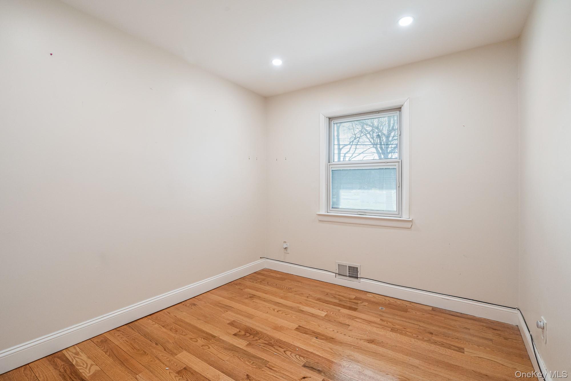 65 39th Street Islip, NY 11751 - Photo 9 of 30 a view of empty room with wooden floor