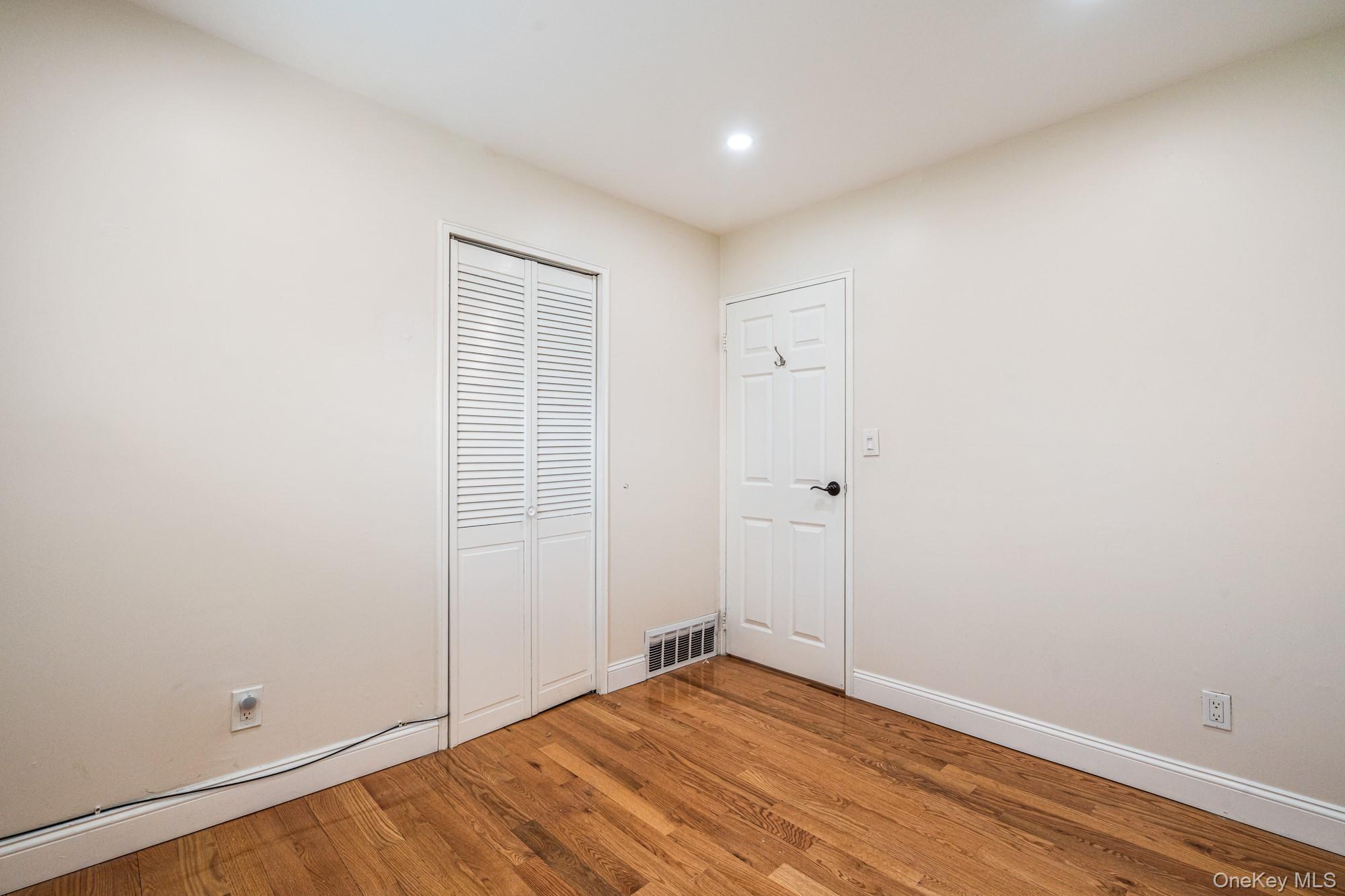 65 39th Street Islip, NY 11751 - Photo 10 of 30 wooden floor in an empty room