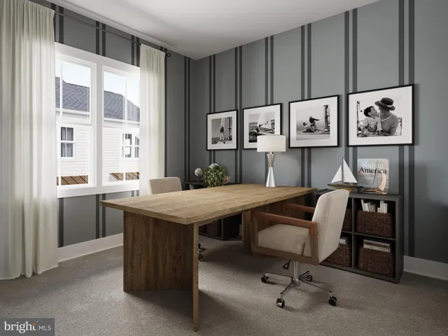 a view of a workspace with furniture