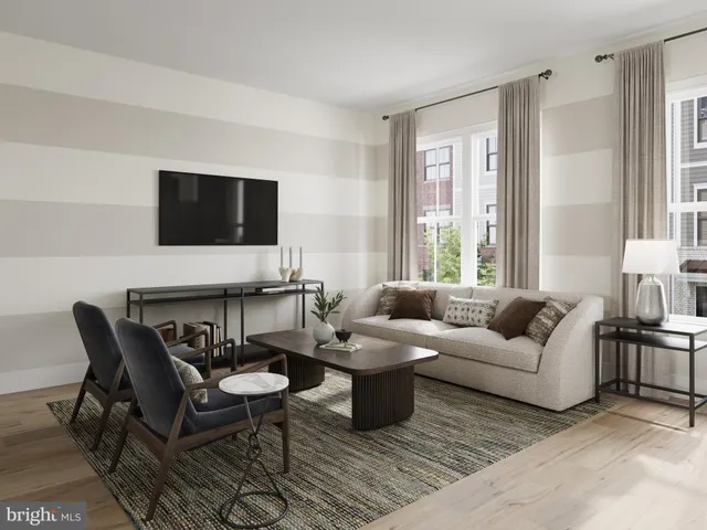 a living room with furniture a flat screen tv and a large window