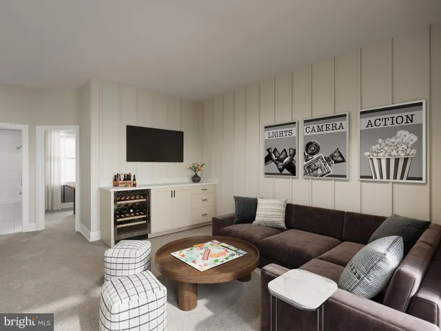 a living room with furniture a rug and a flat screen tv