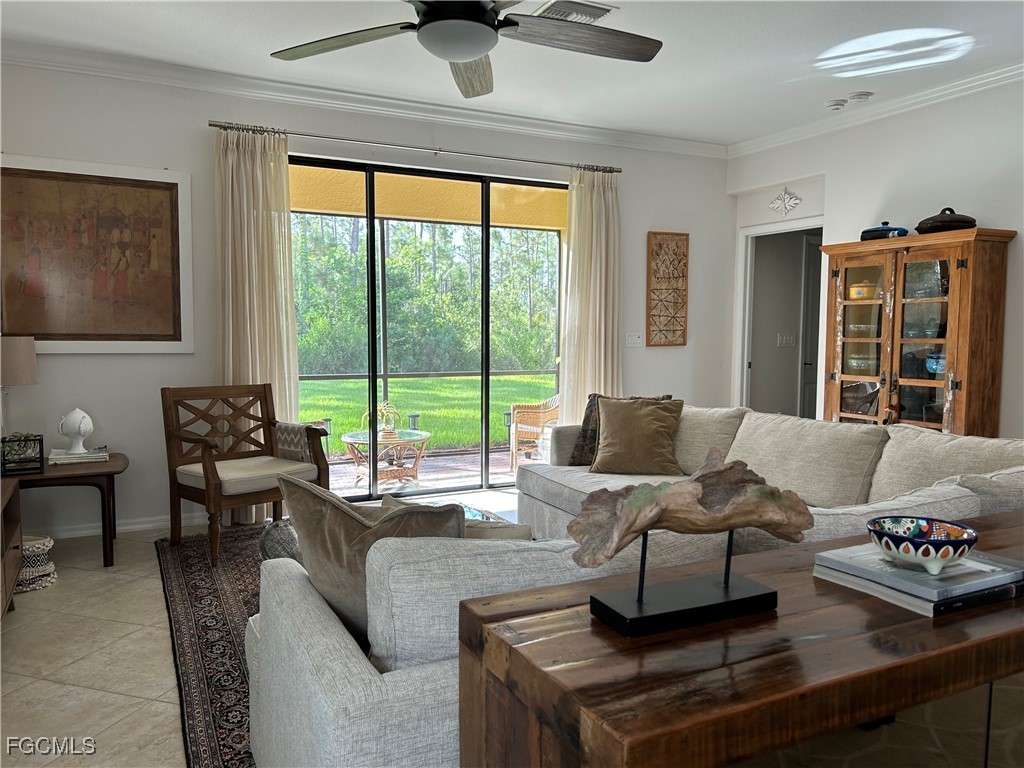 8963 Water Tupelo Road Fort Myers, FL 33912 - Photo 14 of 37 a living room with furniture and large windows