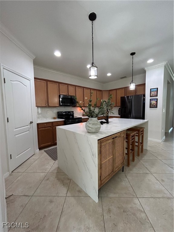 8963 Water Tupelo Road Fort Myers, FL 33912 - Photo 23 of 37 a kitchen with kitchen island granite countertop a sink counter top space appliances and cabinets