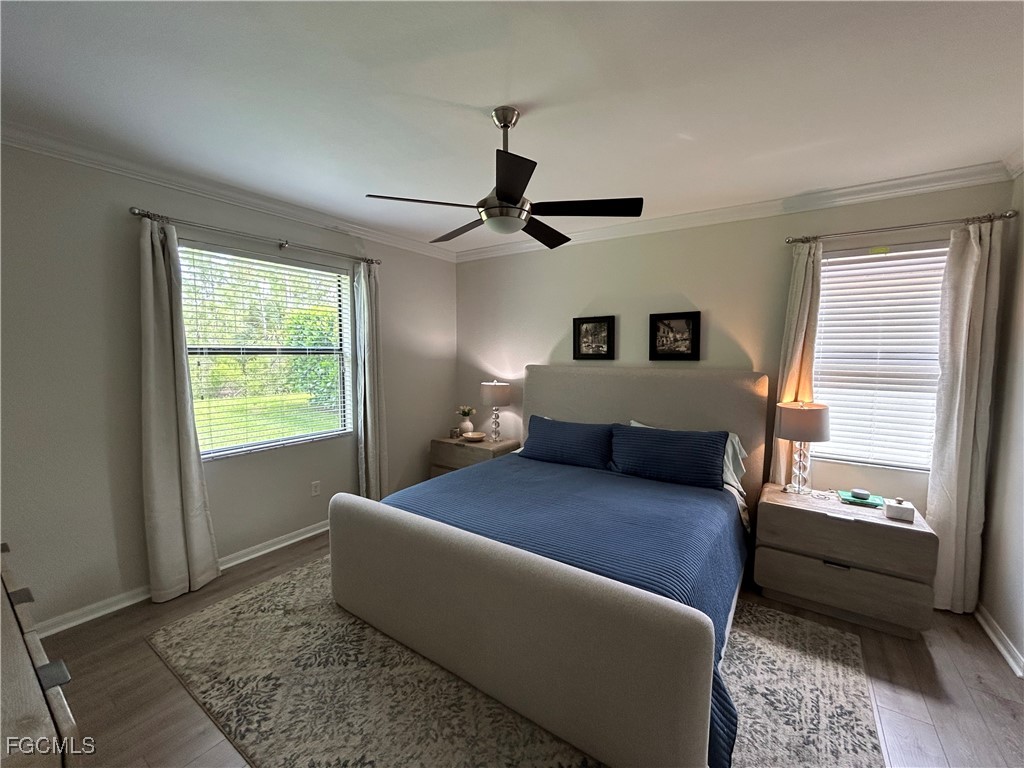 8963 Water Tupelo Road Fort Myers, FL 33912 - Photo 25 of 37 a living room with furniture and a window