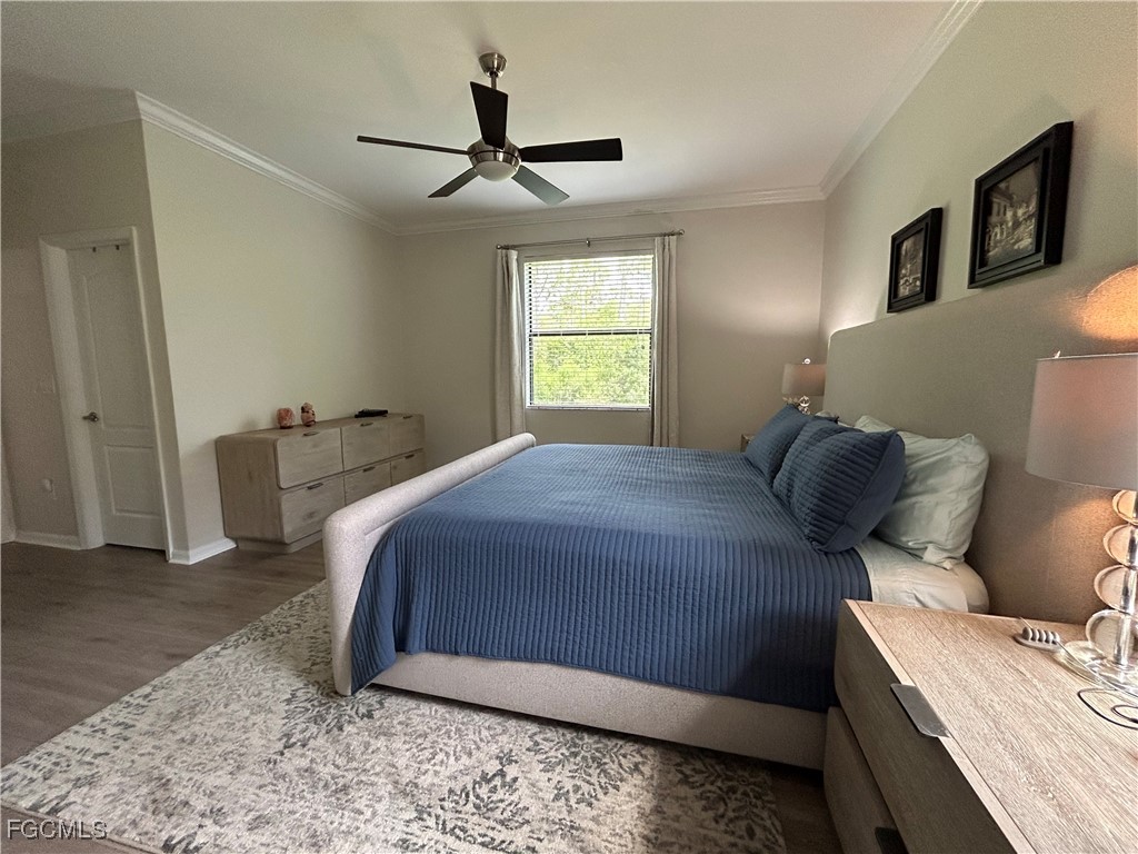 8963 Water Tupelo Road Fort Myers, FL 33912 - Photo 26 of 37 a bedroom with a bed and a mirror