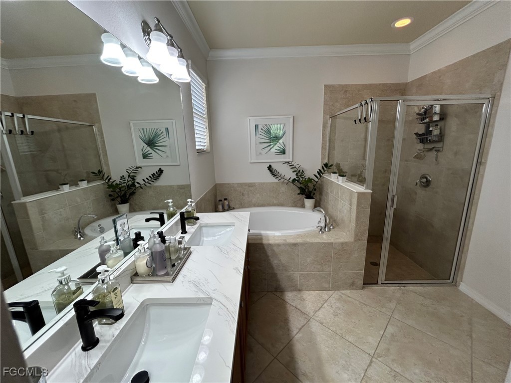 8963 Water Tupelo Road Fort Myers, FL 33912 - Photo 29 of 37 a living room with furniture and a chandelier
